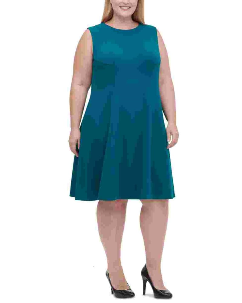 Front of a model wearing a size 14W Tommy Hilfiger Women's Plus Size Sleeveless Fit & Flare Dress Blue Size 14W in Green by Tommy Hilfiger. | dia_product_style_image_id:312538